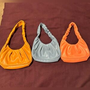 Brand new Olivia and Kate small shoulder purses.